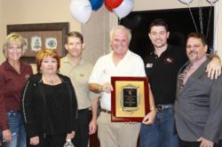RE/MAX Southern Realty Agent James Gilliland named number five commissions paid team in Florida for 2012. Pictured: James Gilliland (holding plaque), his team and RE/MAX Southern Owners and Brokers Kerry Veach and Brad Shoults